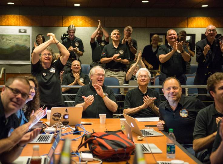 Members of the New Horizons science team react to seeing the spacecraft's last and sharpest image of Pluto before closest approach later in the day, Tuesday, July 14, 2015 at the Johns Hopkins University Applied Physics Laboratory (APL) in Laurel, Maryland. Photo Credit: (NASA/Bill Ingalls)
